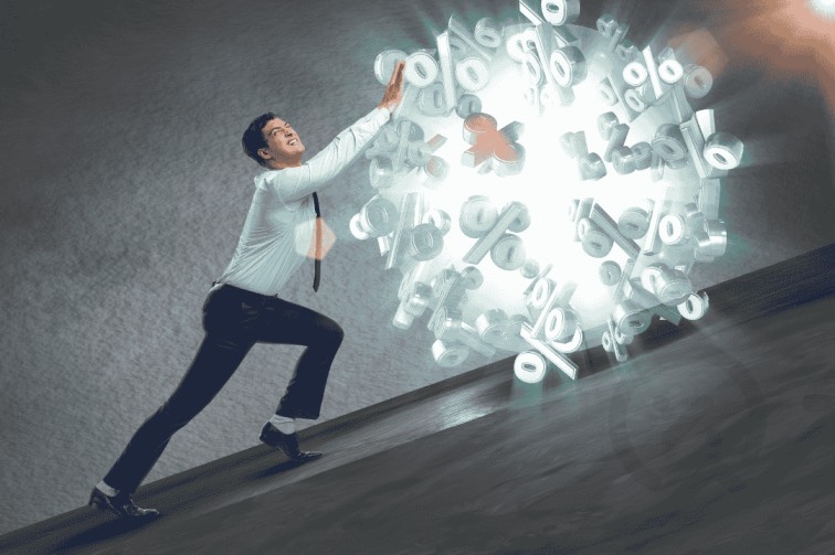 Man struggling with high interest rates symbolising costly loans in New Zealand